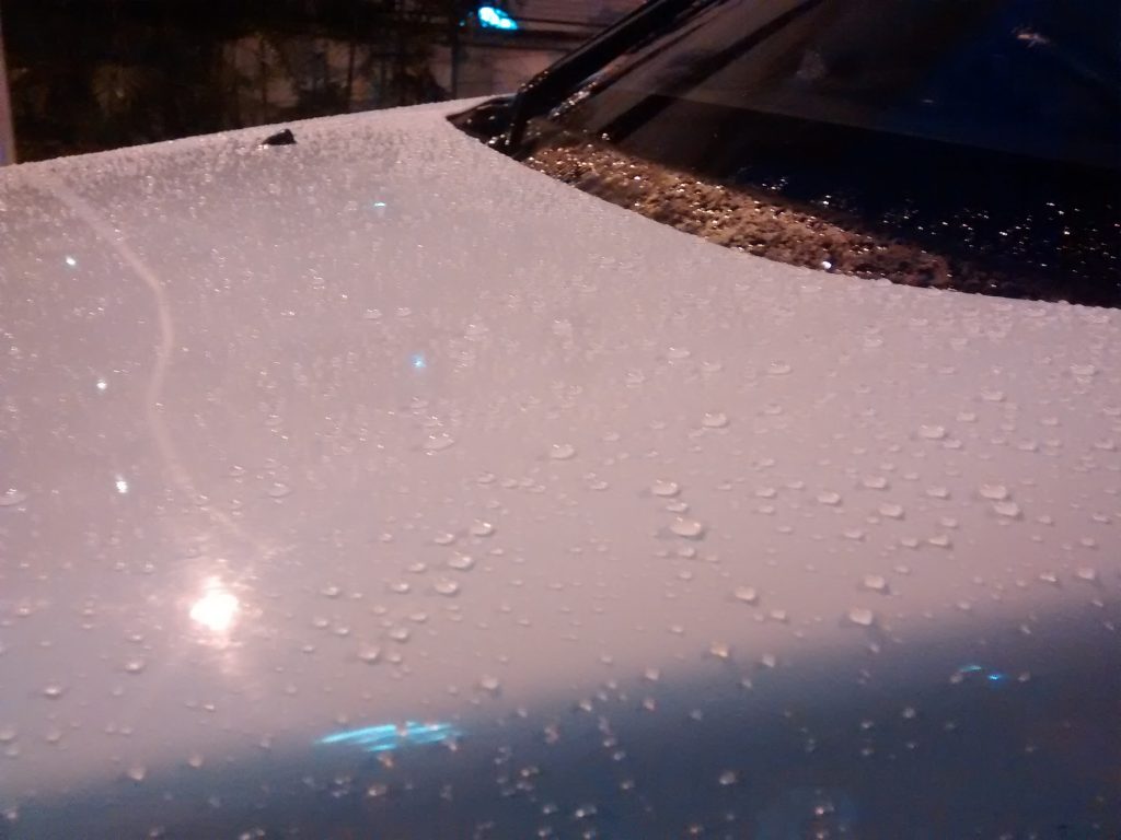 Alto K10 windshield washer nozzle on the bonnet