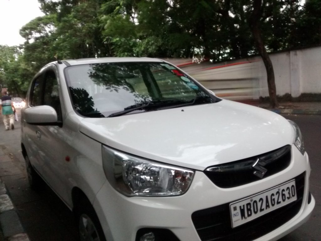 My Alto K10 after a detailing session. Look at the reflection of the pavement on the doors.